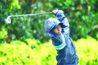 A junior golfer follows his tee shot during the Junior Golf Foundation US Kids tournament at Karen Club at the weekend. PD/ EDWIN OTIENO