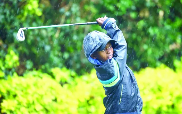 A junior golfer follows his tee shot during the Junior Golf Foundation US Kids tournament at Karen Club at the weekend. PD/ EDWIN OTIENO