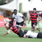 Vincent Onyala (right) of Kenya Simbas tackles Elephans Athenkosi Mayinje of Eastern Province Elephants of South Africa supported by teammate Brian Waraba (left) during their Currie Cup Division One match at RFUEA ground on June 11, 2022.