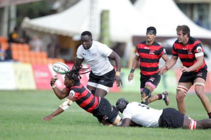 Vincent Onyala (right) of Kenya Simbas tackles Elephans Athenkosi Mayinje of Eastern Province Elephants of South Africa supported by teammate Brian Waraba (left) during their Currie Cup Division One match at RFUEA ground on June 11, 2022.