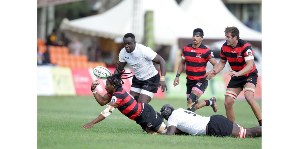 Vincent Onyala (right) of Kenya Simbas tackles Elephans Athenkosi Mayinje of Eastern Province Elephants of South Africa supported by teammate Brian Waraba (left) during their Currie Cup Division One match at RFUEA ground on June 11, 2022.