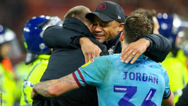 VIncent Kompany (center) celebrates win over Middlesbrough.